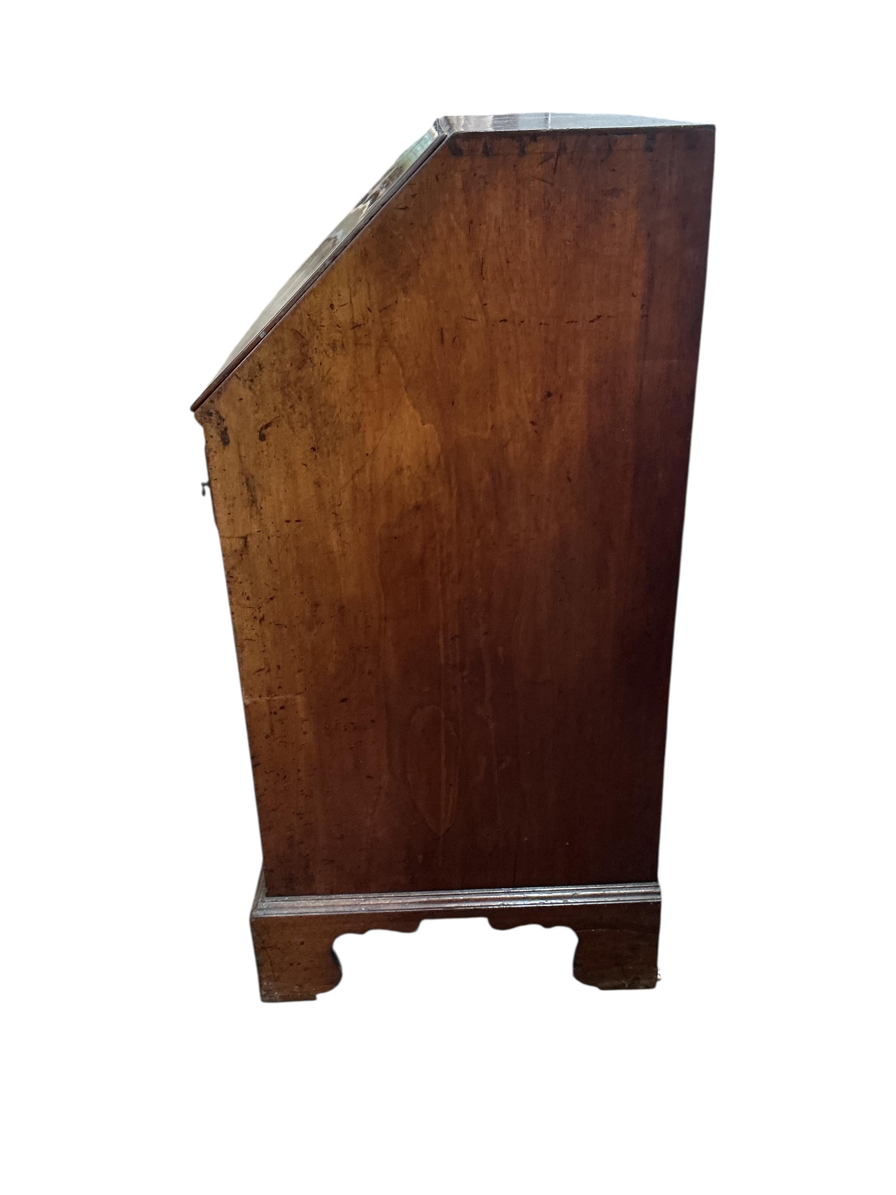 A George III mahogany bureau, with four long drawers on bracket feet, width 91cm, depth 53cm, height 108cm